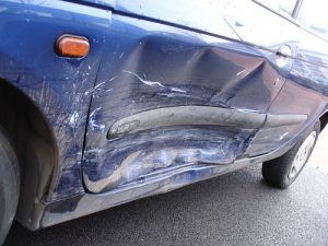 Use a stud welder to remove a dent